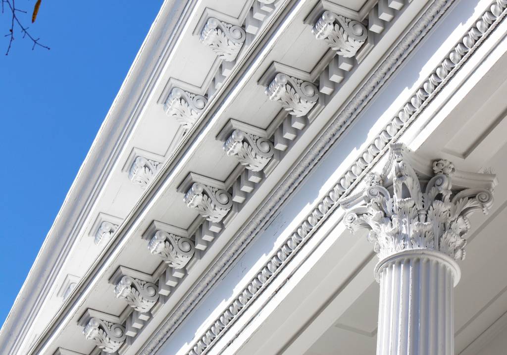 Historic restoration painting by JBG Painting highlighting white architectural columns and ornate trim in Wilmington NC.