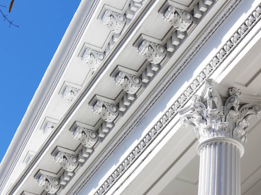 Historic restoration painting by JBG Painting highlighting white architectural columns and ornate trim in Wilmington NC.