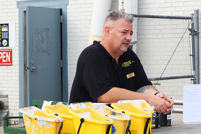 Jeremy from JBG Painting overseeing paint supplies during a Wilmington community project.