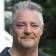 Jeremy, part of the JBG Painting team, in a professional outdoor headshot with a blurred natural background.