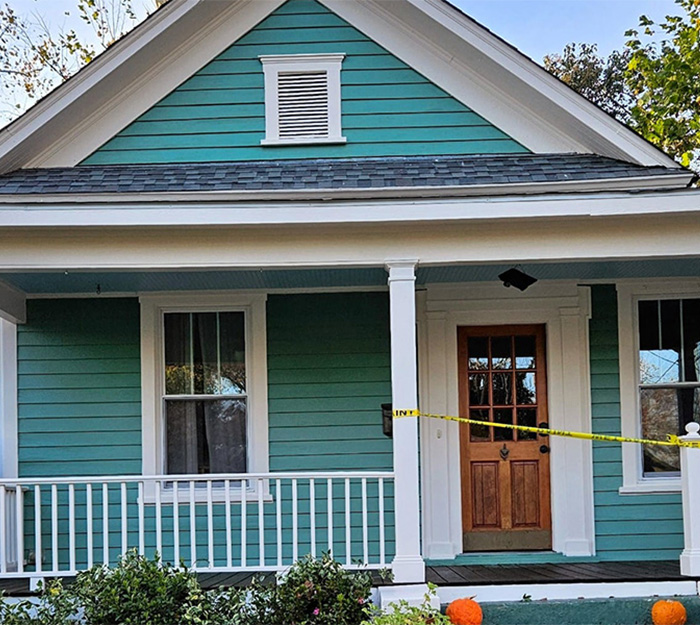 Teal green exterior house with white trim repainted by JBG Painting in Wilmington NC.