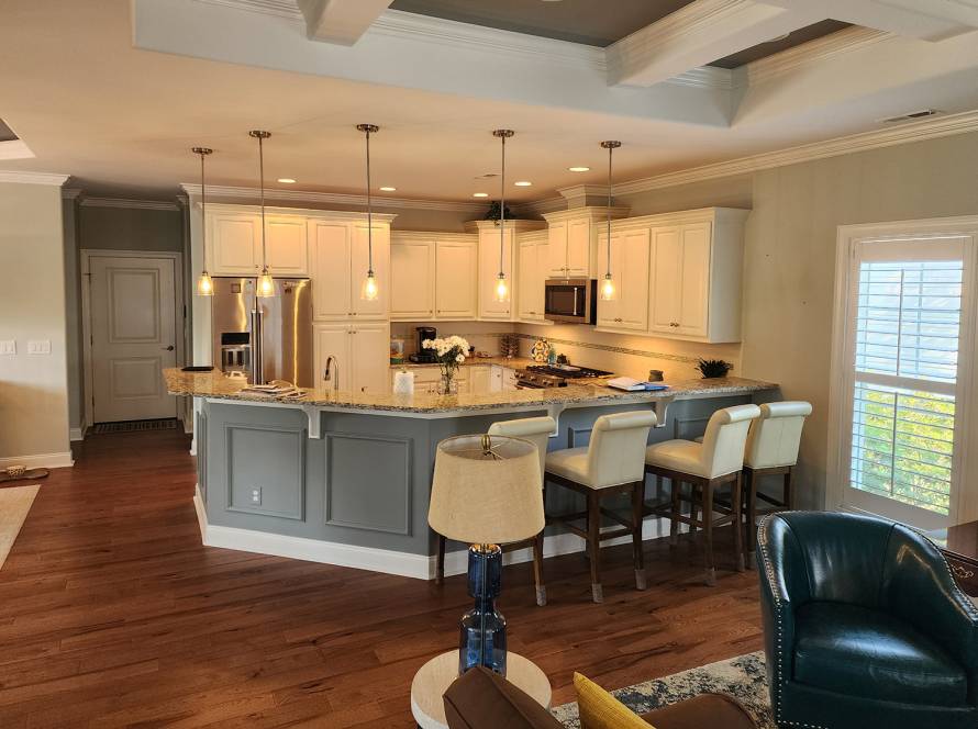 Modern kitchen painted in soft gray and white by JBG Painting with coffered ceiling and pendant lighting.