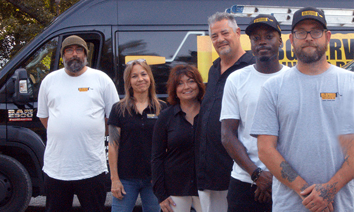 JBG Painting team in Wilmington NC standing together in front of branded service van.