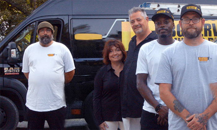 JBG Painting team in Wilmington NC standing together in front of branded service van.