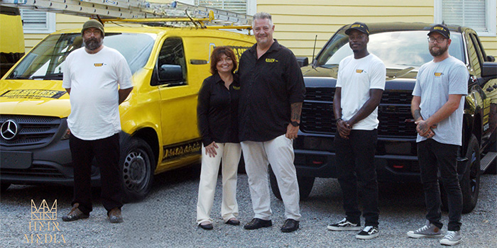 JBG Painting team in Wilmington NC standing together in front of branded service van.